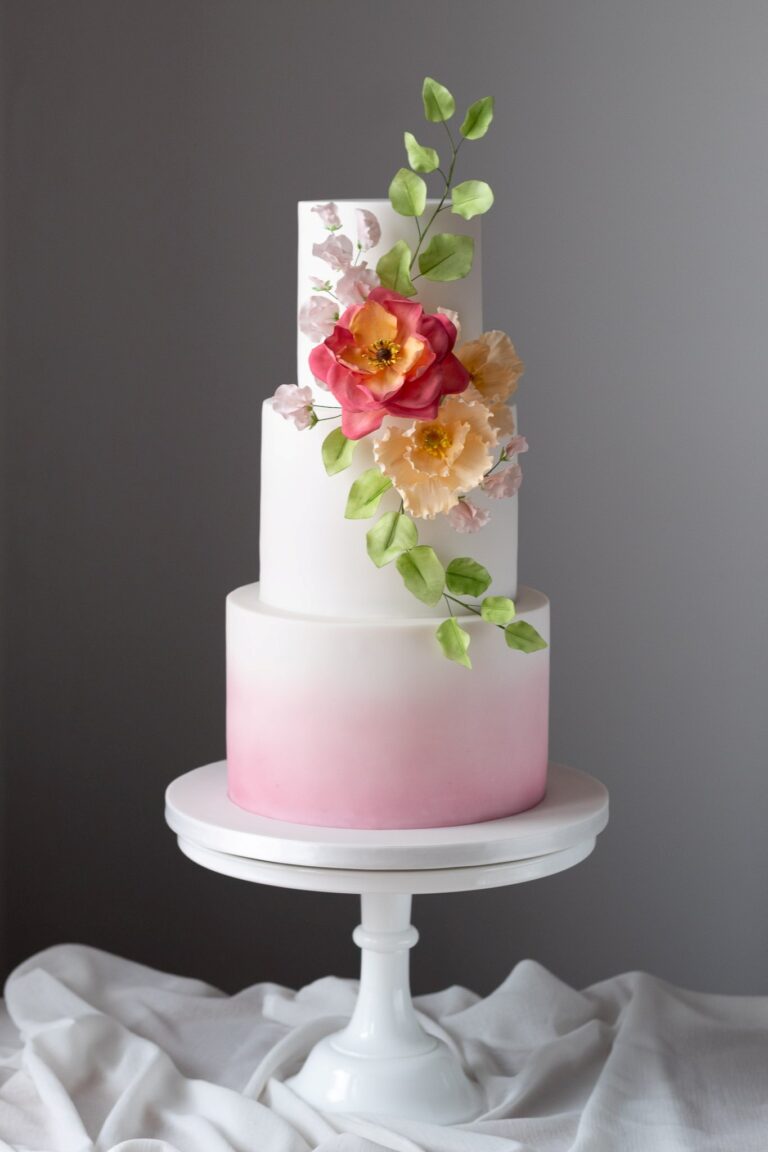 3 tier pink ombre wedding cake with sugar flowers
