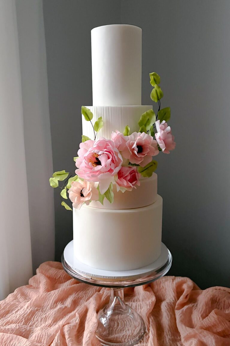4 tier white and pink wedding cake with wafer paper peony and butterfly ranunculus