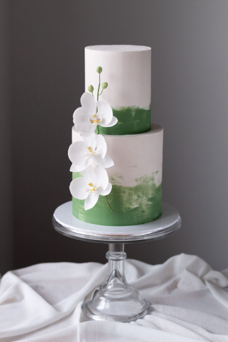 2 tier white and green painted wedding cake with sugar orchid spray 9274