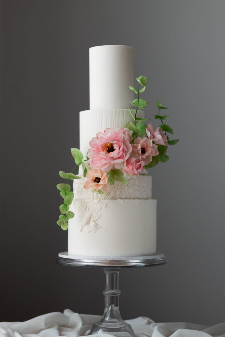 3 tier white wedding cake with wafer paper peony and ranunculus